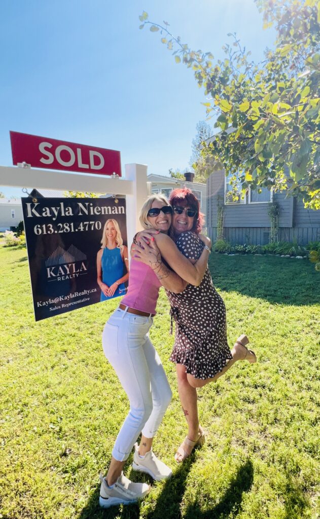 Kayla Nieman REALTOR with client Karen celebrating home sale